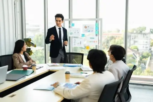 Man giving a strategy presentation to his colleagues