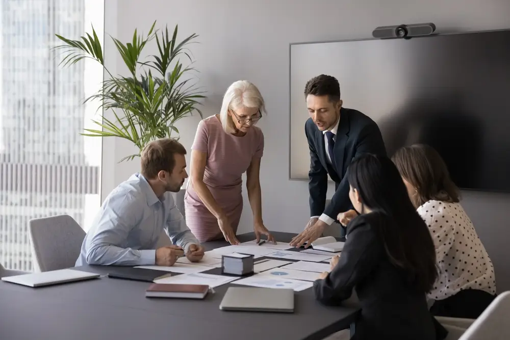 A team looking over restructuring paperwork