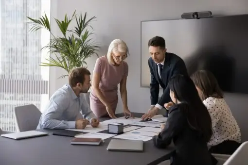 A team looking over restructuring paperwork